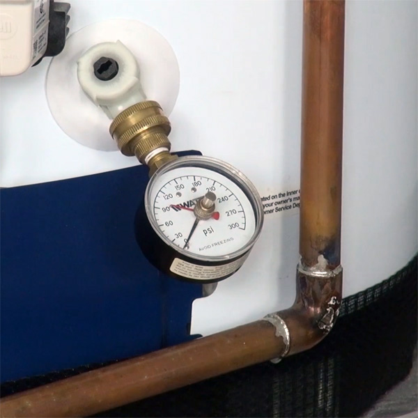 Testing water pressure with gauge Testing water pressure with gauge
