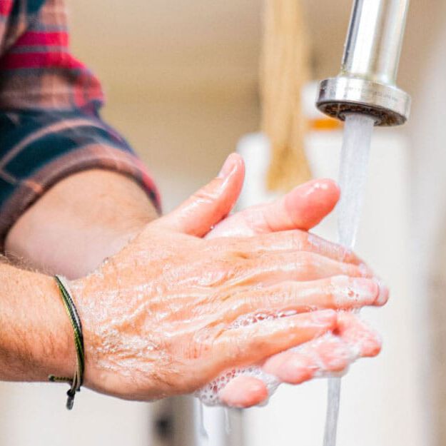 man washing hands man washing hands