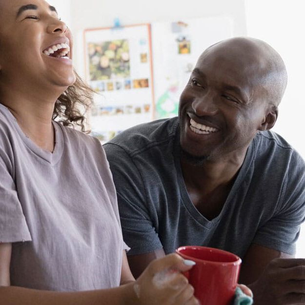Man and woman laughing